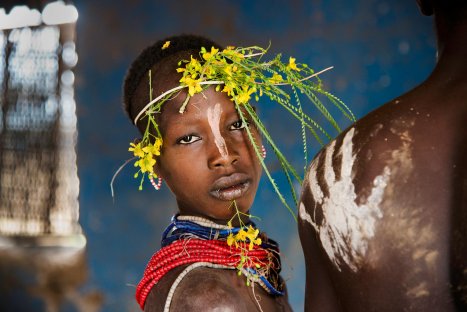 Child adorned with flowers